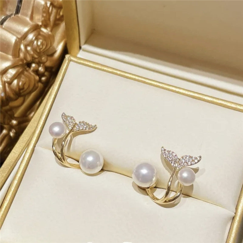 Boucles d’oreilles dorées à détail perlé